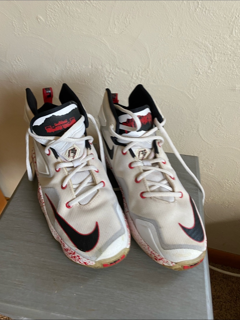 Nike White and Black Basketball Shoes with Red Accents